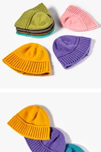 Close-up details of soft knitted beanie hats in multiple vibrant colors for autumn and winter.