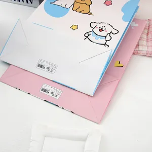 Cute cartoon puppy paper gift bags, pink and white shopping tote bags for presents and parties.