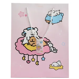 Cute pink paper gift bag with cartoon puppy design, white rope handles, perfect for party favors.