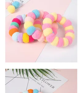 Colorful plush pompom pet collar detail shot, soft material, cute design for cats.