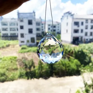 Detailed view of the crystal glass pendant showing multiple facets and hanging design for home decor