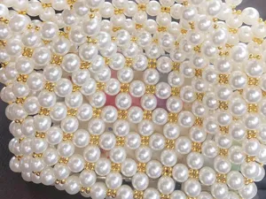 Close-up of handmade woven pearl beaded bag texture, elegant shiny artificial pearl details.