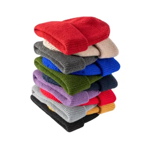 Colorful knitted winter beanies stack, warm solid color hip-hop caps for women and men.