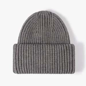 Warm thick ribbed knit winter beanie hat for men and women, stylish cuffed design grey.