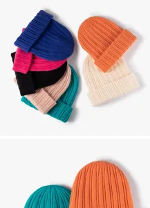 Close-up detail of colorful knitted beanie hats, soft ribbed knit texture and warm cuff design.