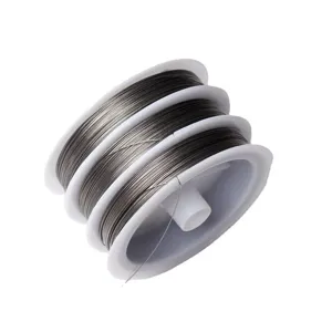 Stainless steel wire spool on white background, perfect for DIY jewelry crafting and beading.