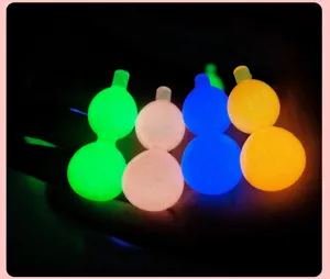 Glow in the dark mini gourd stress relief toy hand play fidget item detailed close up view.