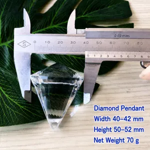 K9 glass crystal diamond pendant detail view showing precision size measurement with caliper tool.