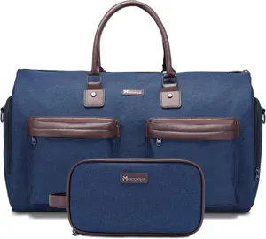 Detailansicht der blauen Segeltuch Reisetasche mit braunen Ledergriffen und passender Tasche.