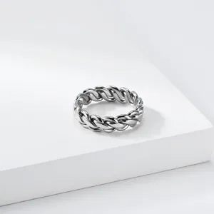 Stainless steel braided chain ring, unisex geometric trendy fashion finger jewelry detail shot.
