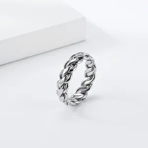 Detail view of a stylish titanium steel braided chain ring, showcasing fine metallic texture.