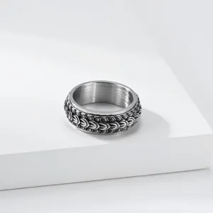 Detailed shot of retro dragon scale rotating spinner ring for men, punk titanium steel band.