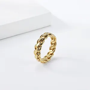 Close-up view of the gold braided chain ring showcasing its intricate metallic texture.