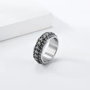 Detail shot of a retro dragon scale stainless steel spinner ring, vintage punk decompression style.