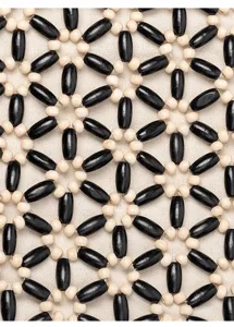Close-up of handmade wooden bead bag texture, featuring black and beige geometric design.
