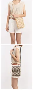 Handmade wooden beaded crossbody bag with hollow geometric design and chic color blocking.