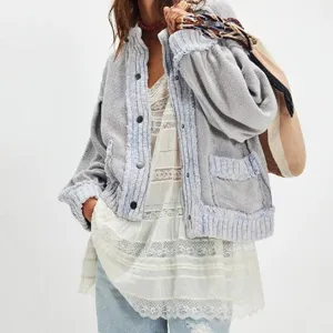Vintage rib-knit short cardigan jacket featuring a stand collar and trendy distressed style.