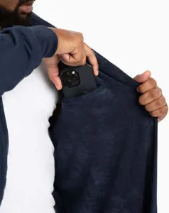 Deep blue plush bathrobe detail shot highlighting the convenient inner pocket for your phone.