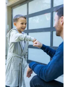 Details of the grey hooded children bathrobe showing comfortable soft fabric and long sleeves.