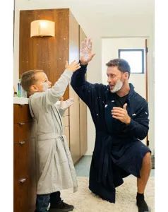 Cozy hooded bathrobe lifestyle detail scene showing family comfort and soft fabric quality.
