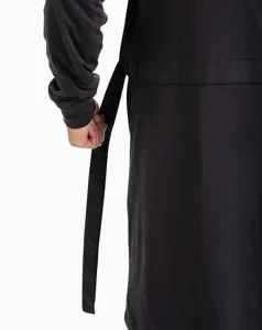 Detail view of the soft black lounge robe showing waist belt design and fabric texture.
