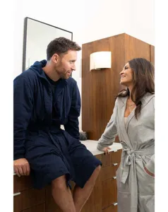 Grey and navy blue hooded bathrobes for men and women, cozy loungewear detail view.