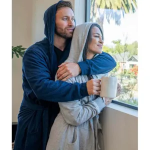 Plush hooded bathrobe for men and women, soft solid color fleece sleepwear for cozy home wear.