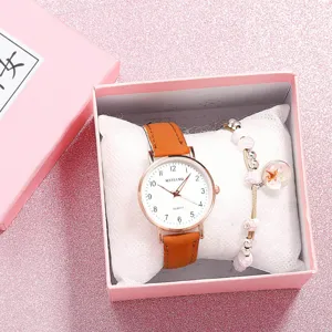 Detailed view of women quartz watch with brown leather strap and pink gift box set.
