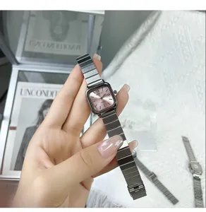 Square quartz watch detail shot, minimalist metal strap, vintage blogger style accessory.