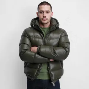 Close-up view of the glossy hooded winter jacket showcasing texture, hood and metal zipper.
