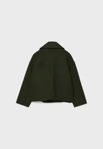 Back view detail of the dark green short wool blend lapel blazer, highlighting tailoring seams.