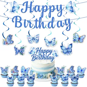 Blue butterfly birthday party decoration details, hanging swirls and cake topper elements.