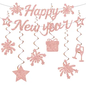 Rose gold glitter Happy New Year banner and hanging swirls detail view for party decor.