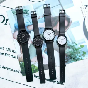 Minimalist quartz wristwatch set with black and white dials and sleek black straps.