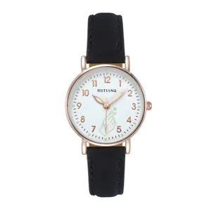 Elegant women's quartz watch detail featuring luminous hands and black leather strap.