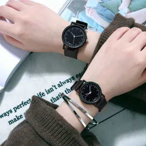Minimalist black dial quartz watch for women, stylish couple watch with sleek leather strap.