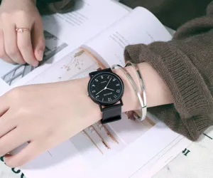 Minimalist women quartz watch with black dial and comfortable strap, casual daily wear style.
