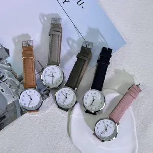 Simple quartz watch with leather strap, minimalist round dial design for daily casual wear.