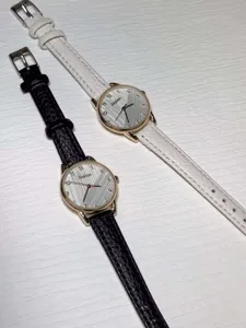 Minimalist quartz watch for women, stylish leather strap daily wrist watch detail view.
