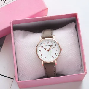 Detailed view of women quartz watch with grey leather strap, rose gold case and white dial.