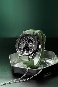 Detail view of the multi-functional sports electronic watch with green strap and clear dual display.