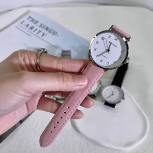 Minimalist quartz watch with pink leather strap and white dial for students and daily wear.