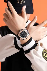 Close-up detail of men's sports electronic watch worn on wrist, featuring stylish dual-display.
