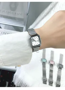 Minimalist square quartz watch for women, stylish silver metal strap retro wrist accessory.