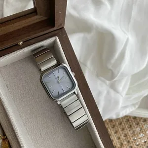 Minimalist square dial women's watch with metal strap, elegant retro daily wear accessory.