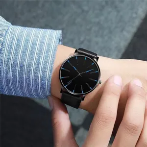 Mens minimalist quartz watch featuring black dial and blue markers on leather strap.