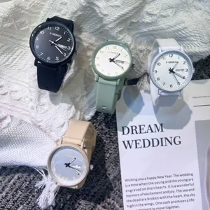 Detail view of minimalist quartz wristwatches in multiple colors with silicone straps and date.