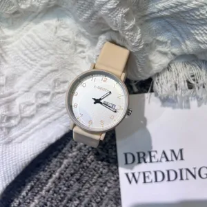 Minimalist student quartz watch with beige strap and clear dial markers for daily exam use.