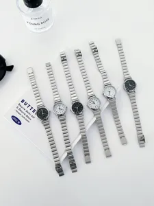 Minimalist women's quartz watch with sleek metal strap and classic round dial for daily wear.
