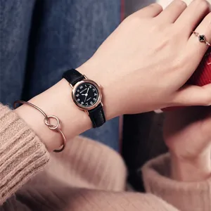 Minimalist women quartz watch with black leather strap and rose gold small dial for daily wear.